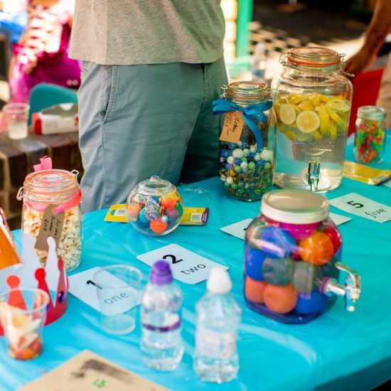 sweets, marbles and flavoured water on a table