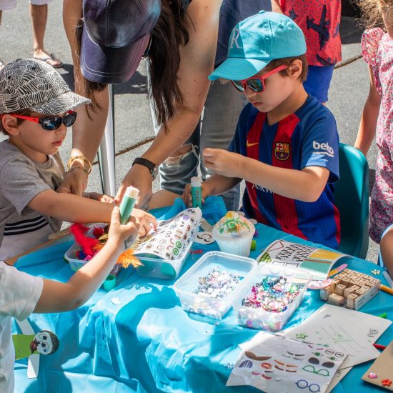 children at the table getting involved in arts and crafts