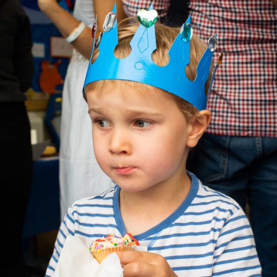 child eating a cupcake