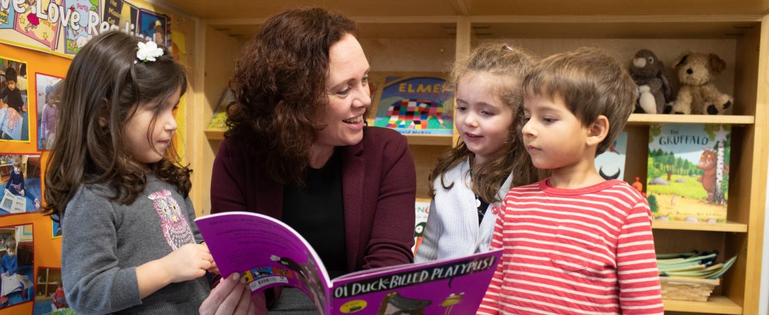 teacher reading a book