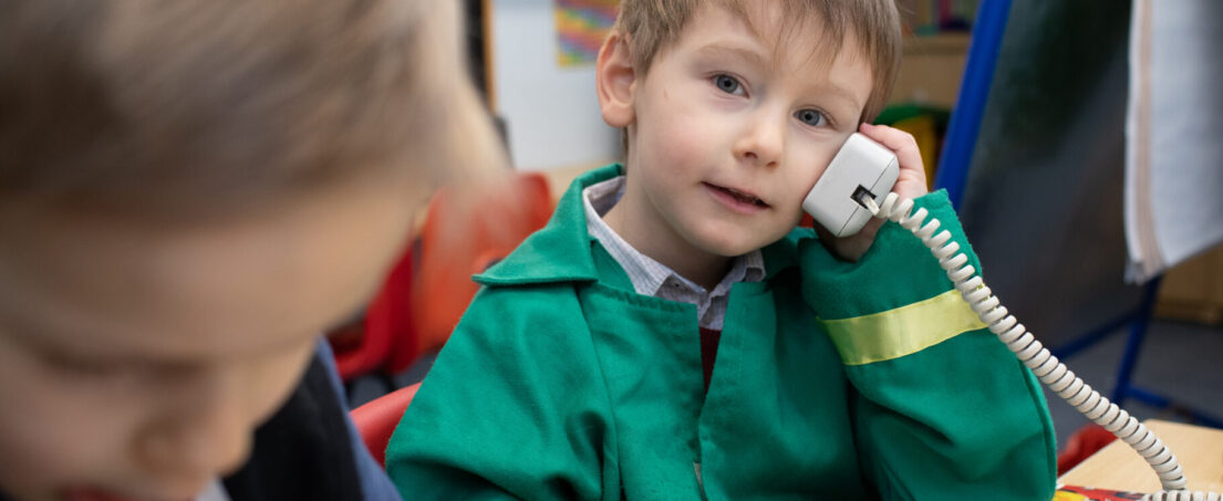 boy using the telephone