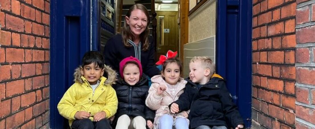 children sat on the steps